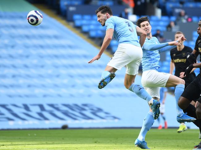 MANCHESTER, ENGLAND - FEBRUARY 27: Ruben Dias of Manchester City scores his team's first goal during the Premier League match between Manchester City and West Ham United at Etihad Stadium on February 27, 2021 in Manchester, England. Sporting stadiums around the UK remain under strict restrictions due to the Coronavirus Pandemic as Government social distancing laws prohibit fans inside venues resulting in games being played behind closed doors. (Photo by Gareth Copley/Getty Images)