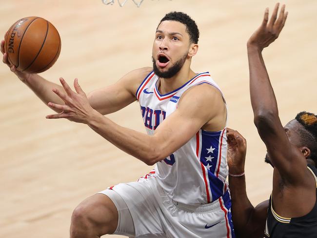 ATLANTA, GEORGIA - JUNE 14:  Ben Simmons #25 of the Philadelphia 76ers drives against Clint Capela #15 of the Atlanta Hawks during the first half of game 4 of the Eastern Conference Semifinals at State Farm Arena on June 14, 2021 in Atlanta, Georgia.  NOTE TO USER: User expressly acknowledges and agrees that, by downloading and or using this photograph, User is consenting to the terms and conditions of the Getty Images License Agreement. (Photo by Kevin C. Cox/Getty Images)