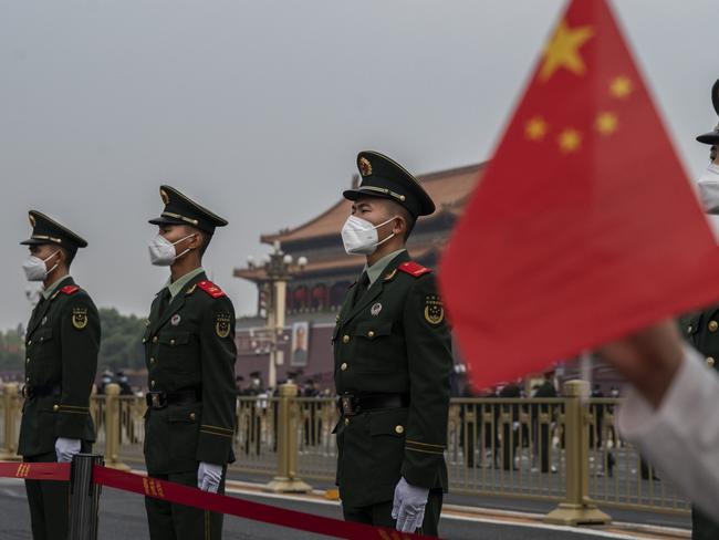 BEIJING, CHINA - OCTOBER 01: Members of the People's Armed Police stand guard at the flag raising ceremony to mark China's national day next to Tiananmen Square on October 1, 2022 in Beijing, China. China celebrates the 73rd anniversary of the founding of the People's Republic of China on October 1st. (Photo by Kevin Frayer/Getty Images)