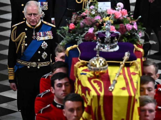 King Charles III walks beside The coffin of Queen Elizabeth II. Picture: AFP
