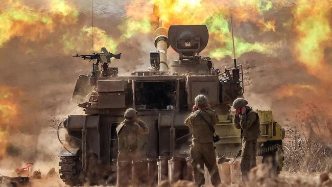 An Israeli army self-propelled howitzer firing close to the border of Gaza. Picture: Jack Guez/Agence France-Presse/Getty Images