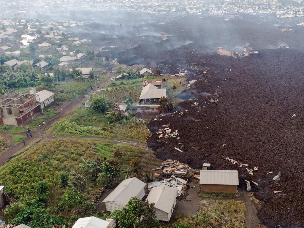 This aerial view shows debris engulfing buildings in Bushara village. Picture: Justin Katumwa/AFP