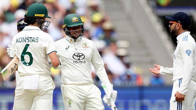 Australia's Sam Konstas, left, has words with India's Virat Kohli, right, with Usman Khawaja the peacemaker, on the opening day of the fourth Test between Australia and India at the MCG on Boxing Day. Photo: Martin Keep / AFP