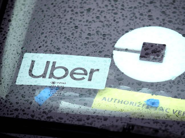 (FILES) In this file photo the Uber logo is displayed on a car on March 22, 2019 in San Francisco, California. - Uber unveiled plans on July 7, 2020 to launch grocery delivery through its recently acquired subsidiary Cornershop. The new service will roll out in cities in Canada and Latin America this week, and in the United States later this month. (Photo by JUSTIN SULLIVAN / GETTY IMAGES NORTH AMERICA / AFP)