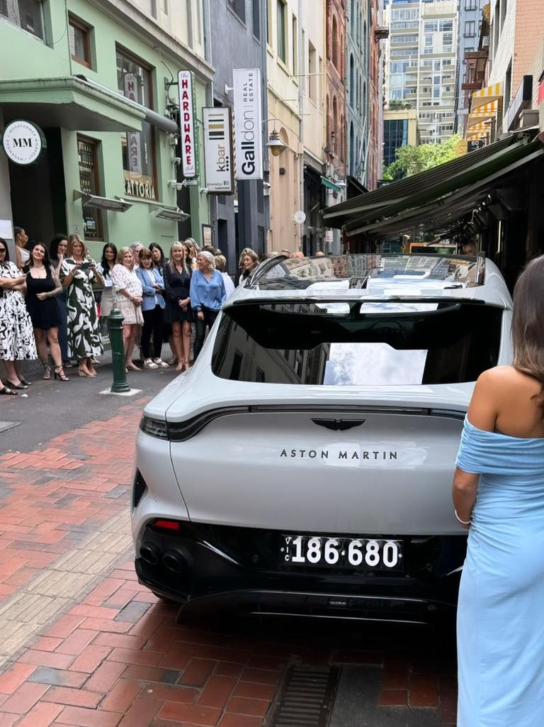 She received an Aston Martin, believed to cost a minimum of $357,000. Picture: Instagram/Adrian Portelli