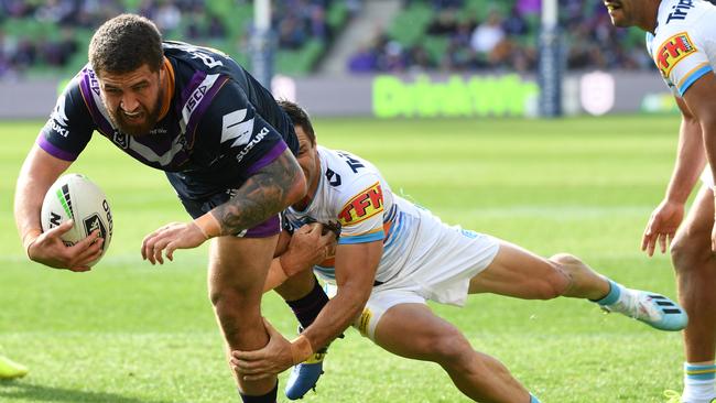 Kenny Bromwich of the Storm (left) is seen as he scores a try during the Round 23 NRL match between the Melbourne Storm and the Gold Coast Titans at AAMI Park in Melbourne, Sunday, August 25, 2019. (AAP Image/Julian Smith) NO ARCHIVING, EDITORIAL USE ONLY