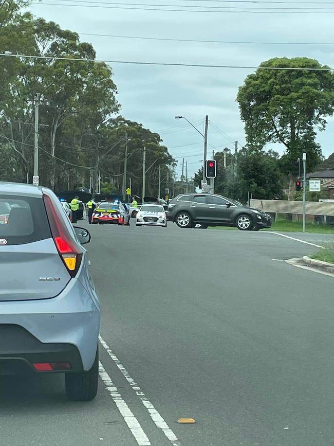 Onlookers noticed police at the scene of the alleged stolen luxury vehicle crash. Photo: Nellie Abela