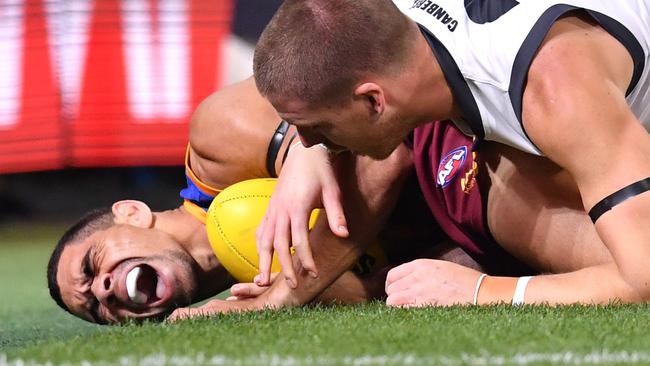 Charlie Cameron reacts after a heavy tackle.