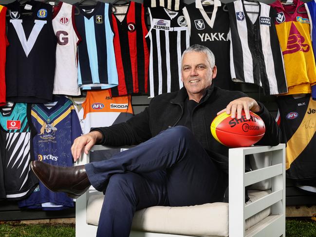 Mark Williams with his collection of football jumpers at his Brighton East home Picture: Michael Klein.