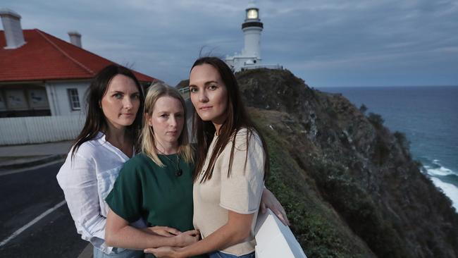 Byron Bay locals Sheri D’Rosario, flanked by twins Jacalyn, left, and Renee Scott at Cape Byron lighthouse, near where Theo Hayez is believed to have vanished. Picture: Lyndon Mechielsen