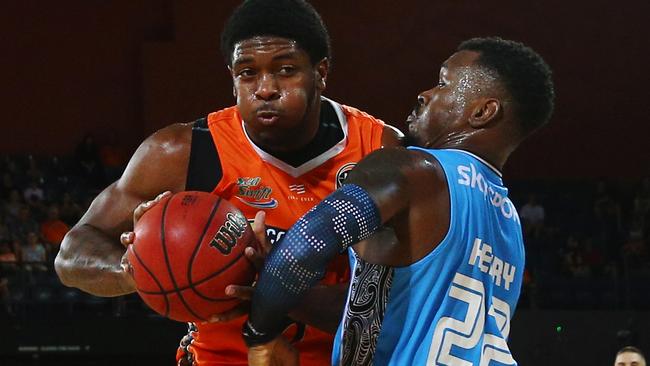 Breakers' Sek Henry puts everything on the line to stop Taipans' Cameron Oliver in the National Basketball League (NBL) match between the Cairns Taipans and the New Zealand Breakers, held at the Cairns Convention Centre. PICTURE: BRENDAN RADKE