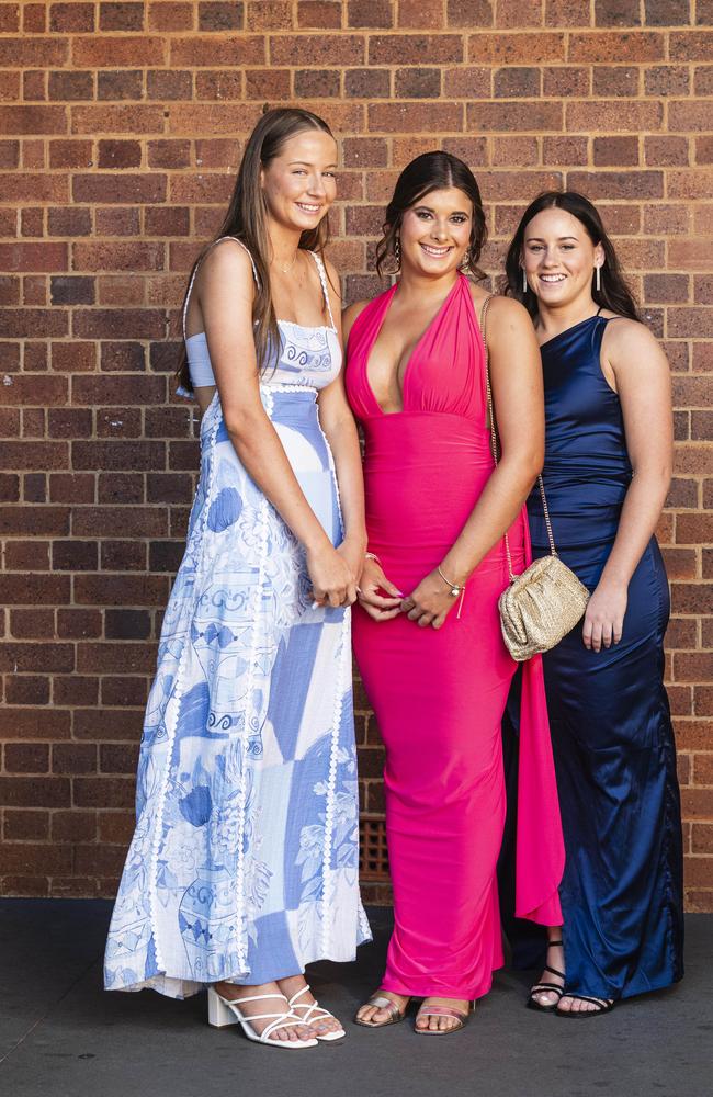 Graduates (from left) Ruby Osmotherly, Georgia Reimers and Bridie Burton as Downlands College year 12 students come together for their valedictory mass at the college, Saturday, November 16, 2024. Picture: Kevin Farmer