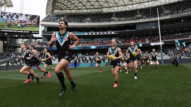 Scott Lycett of Port Adelaide runs out for his 100th game during the round 11 AFL match between the Power and the Richmond Tigers at Adelaide Oval. Picture: Mark Brake / Getty Images