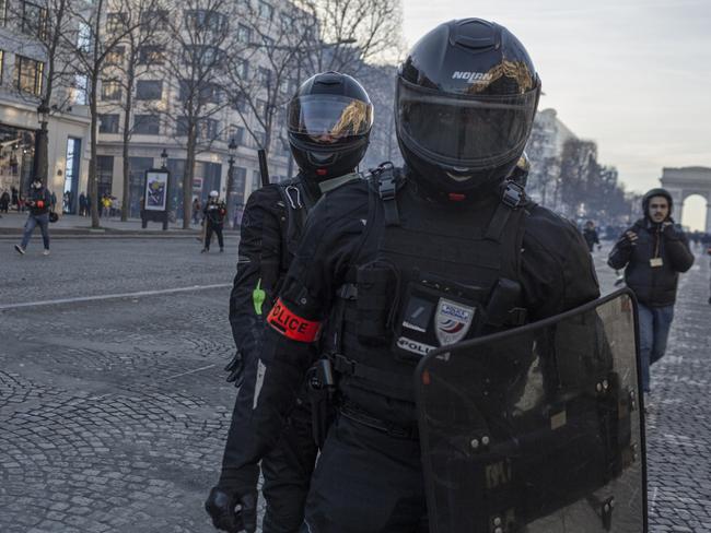 Police disperse supporters of the Freedom Convoy on the Champs Elysees, Paris which cropped up in solidarity with truckers in Canada. Picture: Getty Images