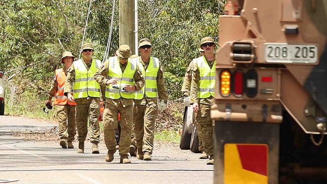 ADF help in the clean up at Kriedeman Road in Wangawallan after ferocious storms dame the Gold Coast area. Pics Adam Head