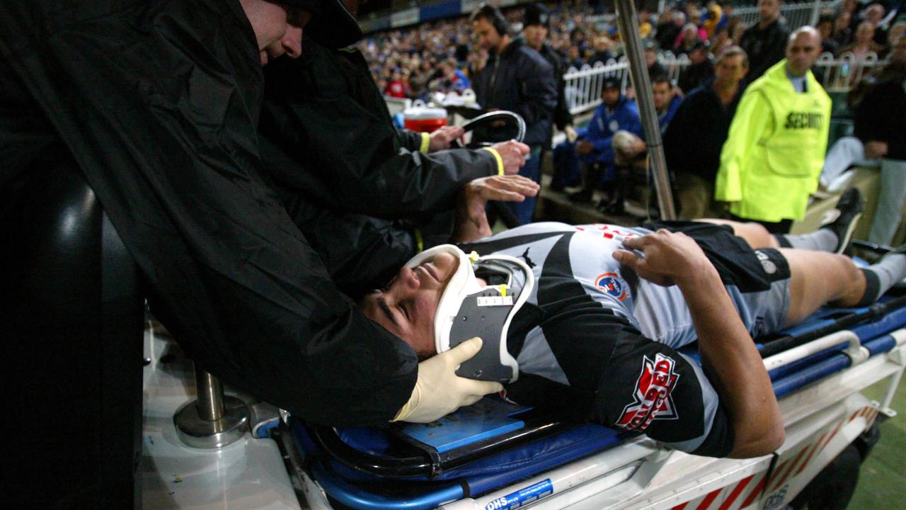 PJ Marsh taken off with what would turn out to be a career-ending injury (AAP/Action Photographics).