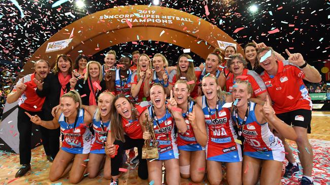 NSW Swifts players and staff celebrate winning the Super Netball grand final against Sunshine Coast Lightning in September. Picture: AAP