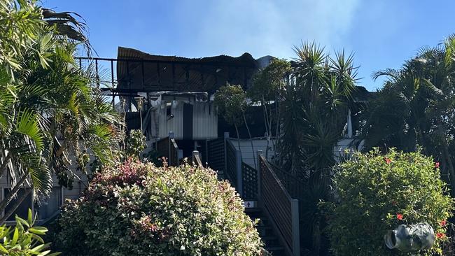Police set up a crime scene at Barnacles Backpackers in Bowen after a fire engulfed the building, April 30, 2025