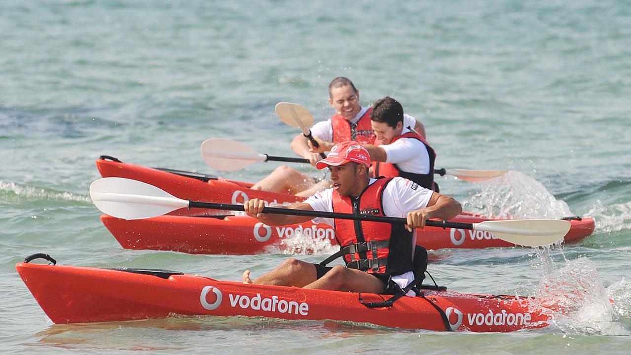 A race of a different kind ... Hamilton leads Aussie Supercar legends Jamie Whincup and Craig Lowndes in a Vodafone promotional event in Melbourne ahead of the 2008 Australian Grand Prix. Photo: AAP Image