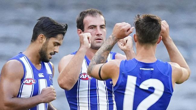 Paddy Ryder of the Saints has his kick for goal smothered by Jared Polec of the Kangaroos in the final minute of play during the Round 1 AFL match between the North Melbourne Kangaroos and the St Kilda Saints at Marvel Stadium in Melbourne, Sunday, March 22, 2020. (AAP Image/Scott Barbour) NO ARCHIVING, EDITORIAL USE ONLY