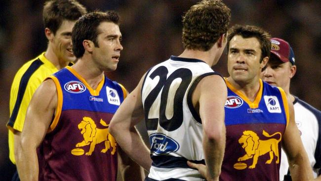 The Scott brothers rip into Steve Johnson during the 2004 preliminary final.