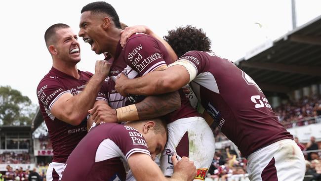 The Sea Eagles celebrate after a Jason Saab (centre) trysaver (Photo by Cameron Spencer/Getty Images)