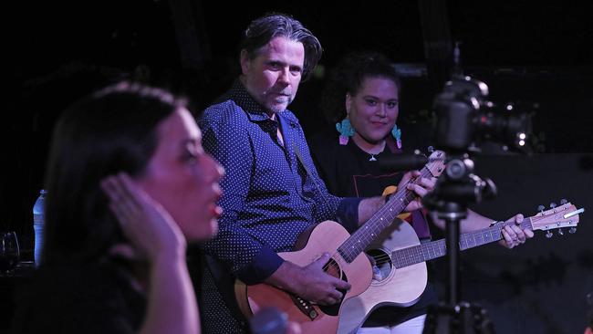 Pub Choir’s Astrid Jorgensen (left) with Powderfinger bassist John Collins and Waveney Yasso on guitar, at The Triffid in March 2018. Picture: Lyndon Mechielsen.