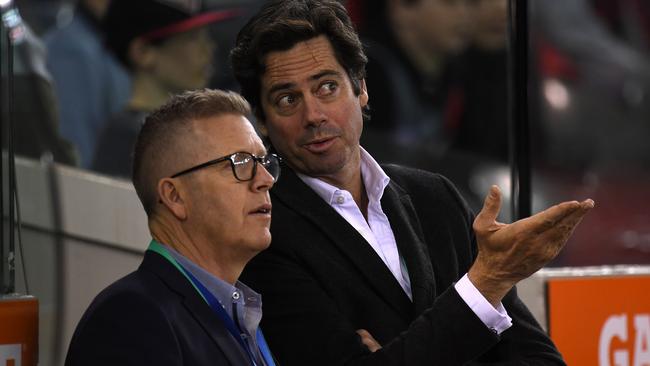 AFL football operations boss Steve Hocking and AFL CEO Gillon McLachlan are seen in the interchange area during the Round 19 AFL match between the Essendon and Sydney at Etihad Stadium in July. Picture: AAP Image/Julian Smith