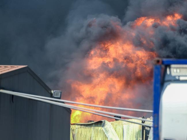 NTFES attend a massive blaze on College road, Berrimah. Picture: Glenn Campbell