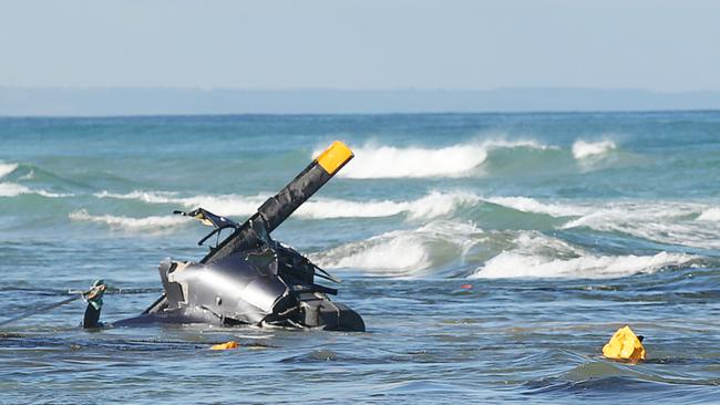 Helicopter crashes in the shallows between Ocean Grove and Point Lonsdale. Picture: Alan Barber