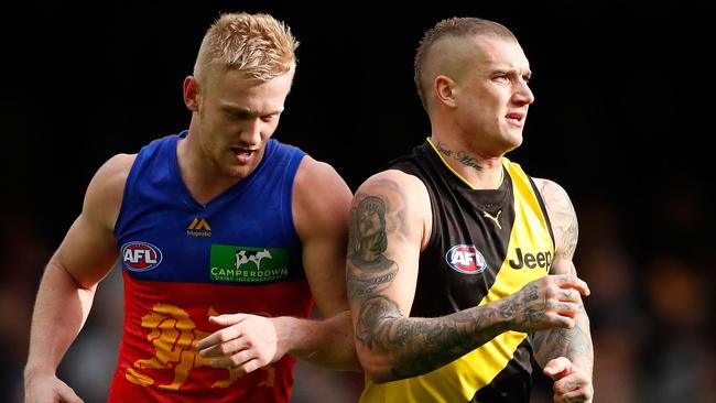 MELBOURNE, AUSTRALIA - JULY 16: Nick Robertson of the Lions niggles opponent Dustin Martin of the Tigers during the 2017 AFL round 17 match between the Richmond Tigers and the Brisbane Lions at Etihad Stadium on July 16, 2017 in Melbourne, Australia. (Photo by Adam Trafford/AFL Media/Getty Images)