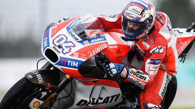 Andrea Dovizioso set the pace during wet Malaysian MotoGP practice sessions.