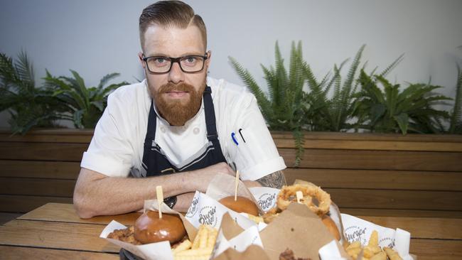 Head Chef Nathan McNamara, with some of The Mill’s burger creations. Picture: Melvyn Knipe