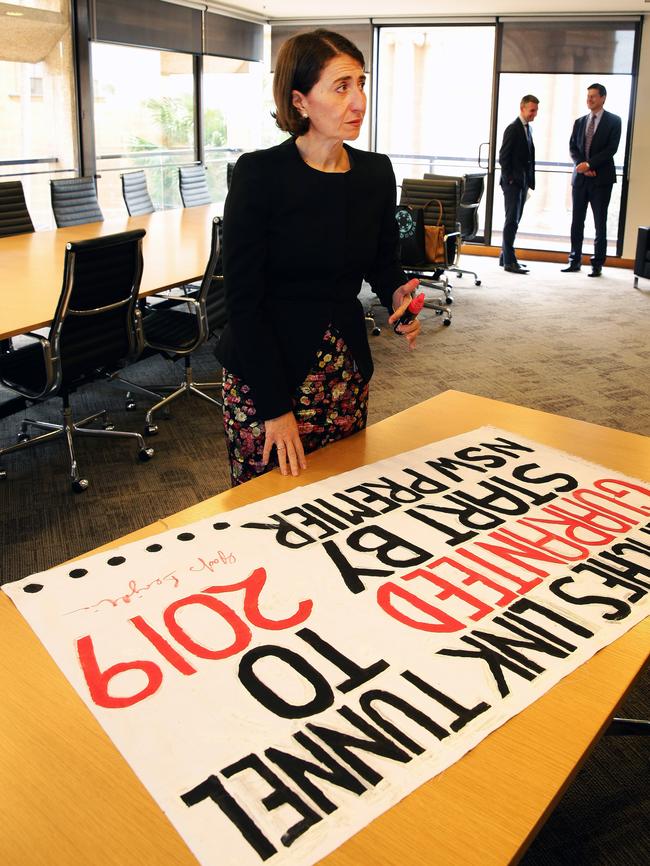 Gladys Berejiklian signs a pledge in April last year to get work started on the tunnel.