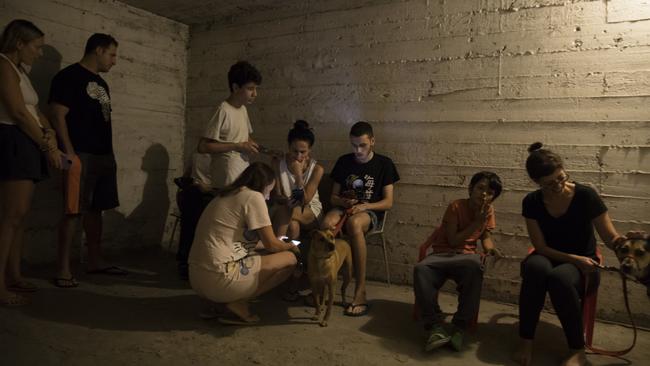 People take refuge in a shelter as sirens heard on October 7, 2023 in Tel Aviv, Israel. Picture: Amir Levy/Getty Images