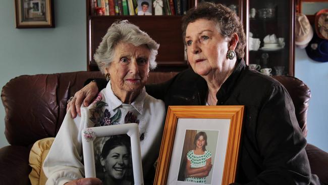 Beth Leen with a photo of her daughter Leanne Goodall who went missing aged 20 years in 1978, with Anne Robinson who holds a photo of her daughter Amanda Robinson who went missing aged 14 years in 1979.