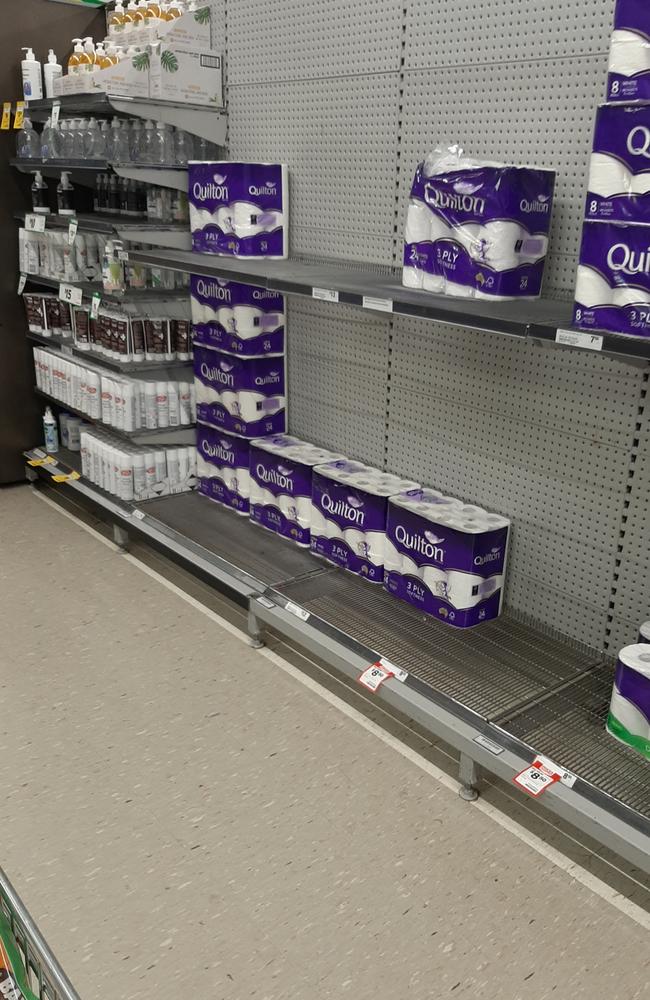 Shelves have been stripped at Woolworths Caboolture South. Photo: Erin Smith