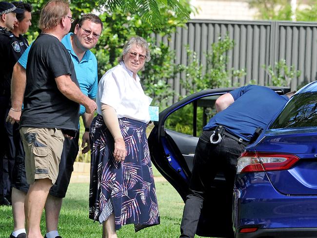 A witness being taken away for questioning by police. Picture: John Gass