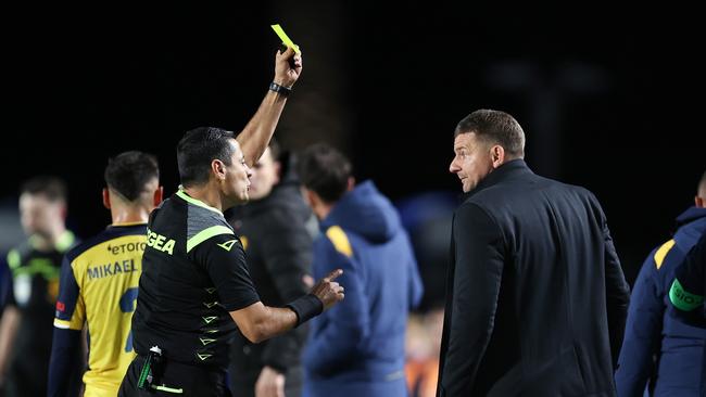 GOSFORD, AUSTRALIA – MAY 18: Referee Alireza Faghani shows Mariners coach Mark Jackson a yellow card during the A-League Men Semi Final match between Central Coast Mariners and Sydney FC last season. (Photo by Brendon Thorne/Getty Images)