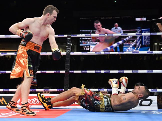 Australian boxer Jeff Horn knocks out Anthony Mundine in the first round of the River City Rumble boxing match at Suncorp Stadium in Brisbane. Picture: AAP