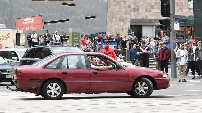 The car pictured outside Flinders St railway station before the deaths. Picture: Tony Gough