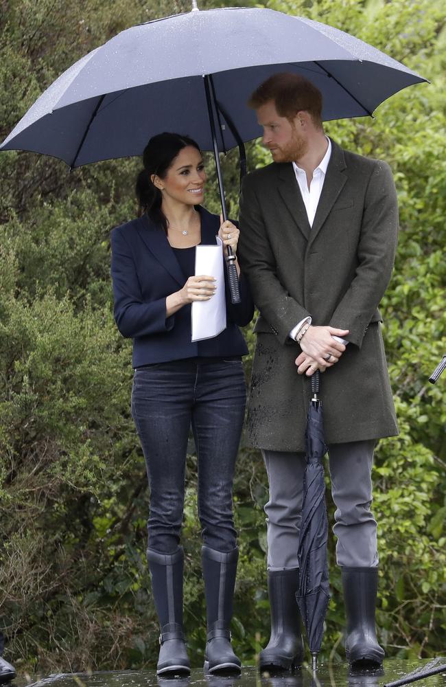 Yesterday he held the umbrella for her, today she’s holding it for him. TEAMWORK. Picture: AP