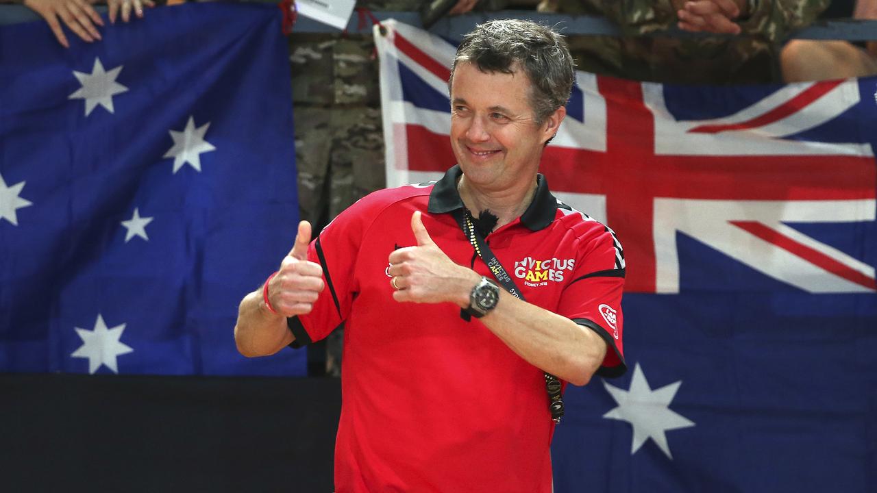 Denmark's Crown Prince Frederik gestures towards players as he congratulates members of Denmark's sitting volleyball team after their victory over Canada at the Invictus Games in Sydney yesterday.