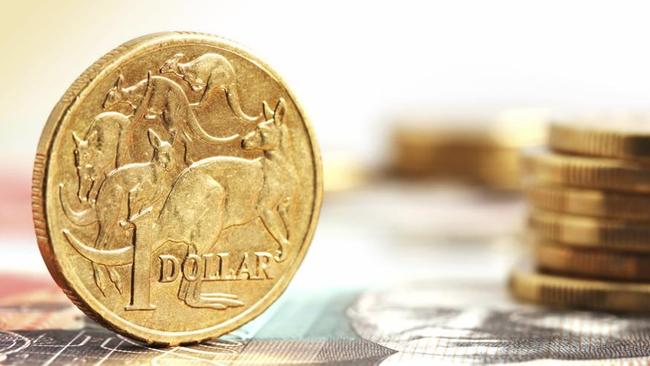 Aussie one dollar coins, on a twenty dollar note.