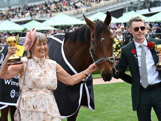 MELBOURNE, AUSTRALIA - NOVEMBER 09:  Melbourne Cup winning Co trainers Sheila Laxon and John Symons, jockey Robbie Dolan and connections pose with Knight's Choice during Champion Stakes Day at Flemington Racecourse on November 09, 2024 in Melbourne, Australia. (Photo by Vince Caligiuri/Getty Images)