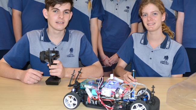 Pimlico High's Landon Barr and Xian Neale and other students with one of the hydrogen fuel cell remote-controlled cars.