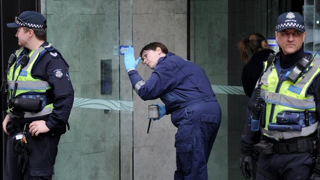 Forensic police examine the entrance to EQ after the teenager’s death. Picture: Andrew Henshaw