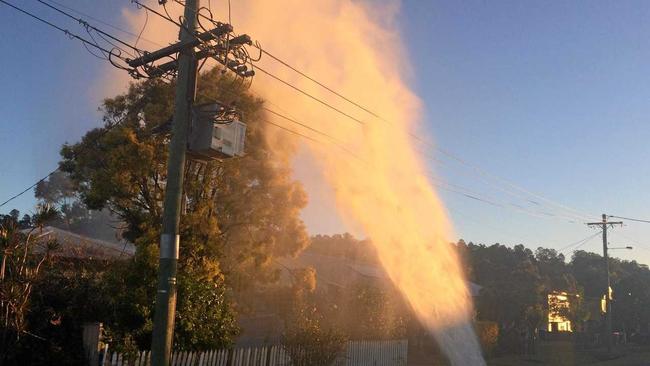 BURST MAIN: Rocks, earth and broken pipe material were flung into the air and showered into the backyard of a home when the water main exploded in Walker St, East Lismore. Picture: Alison Paterson