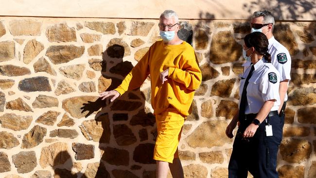 Mark Peter Adams in custody charged with $2 million worth of arson, visits the scenes in Ward Street, North Adelaide with a judge and jury Picture: NCA NewsWire / Kelly Barnes