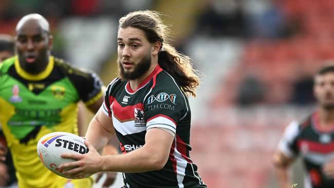 LEIGH, ENGLAND - OCTOBER 30: Khaled Rajab of Lebanon breaks with the ball during Rugby League World Cup 2021 Pool C match between Lebanon and Jamaica at Leigh Sports Village on October 30, 2022 in Leigh, England. (Photo by Gareth Copley/Getty Images)